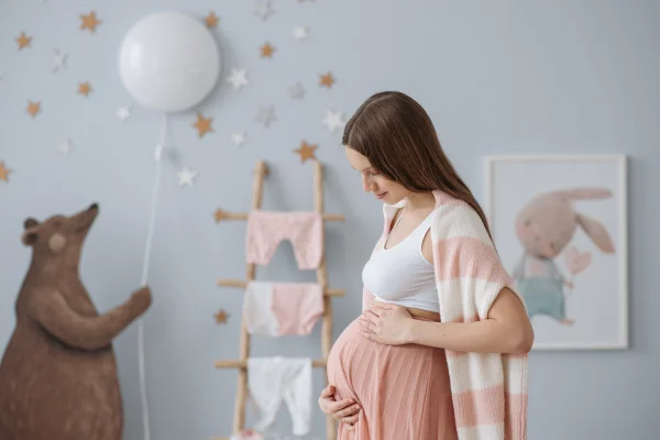 Pregnant woman looking at nursery
