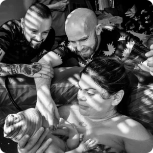 Surrogates give birth with fathers watching